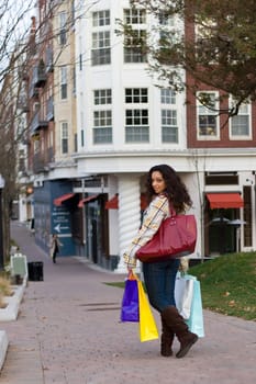 An attractive girl out shopping in the city.