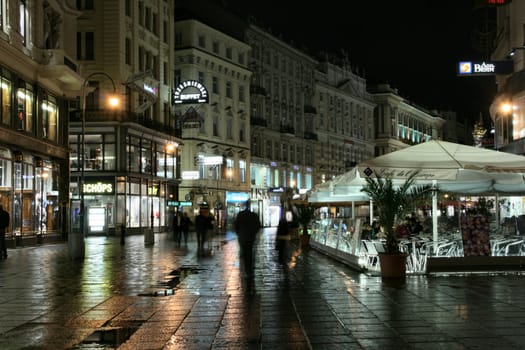 Vienna - famous Graben street at night with rain reflection on the cobbles