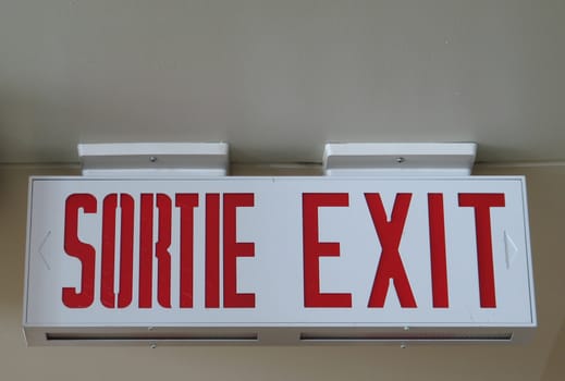 bilingual exit sign