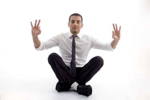 professional man doing yoga on an isolated white background