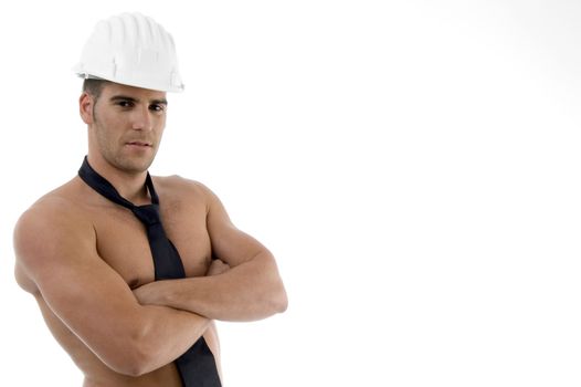 side view of muscular man with architect helmet against white background