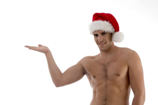 young guy posing in christmas hat with hand gesture against white background