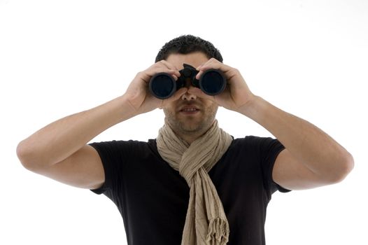 portrait of man looking into binocular on an isolated background