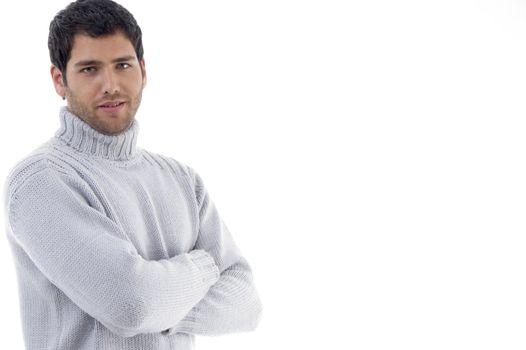 handsome guy with crossed arms on an isolated background