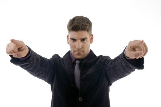 handsome young attorney pointing with both fingers against white background