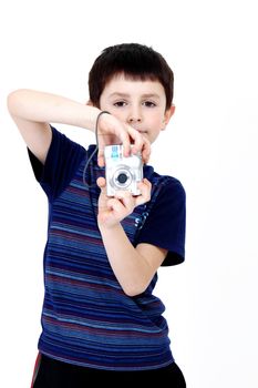 Young boy with digital camera prepare for shooting