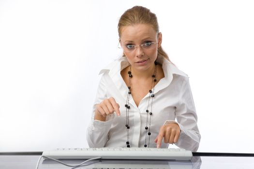 The girl puzzled prints on the keyboard