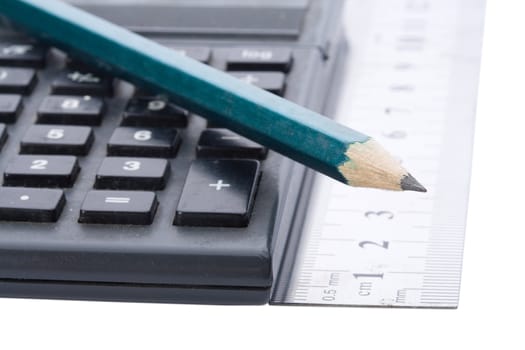 maths equipment, calculator, rule and a pencil, isolated