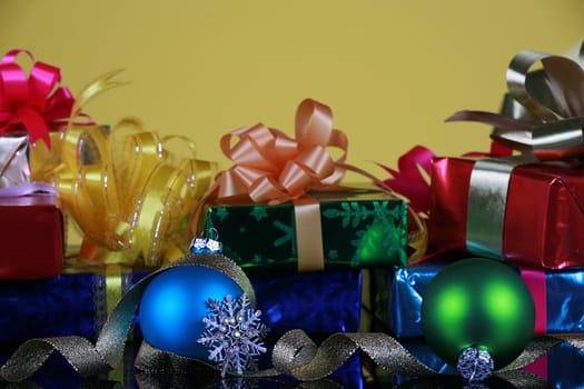 Christmas presents and decorations, focus on blue ball, snowflake and gold ribbons
