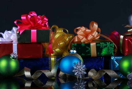 Christmas presents and decorations, focus on blue ball ,snowflake and gold ribbons