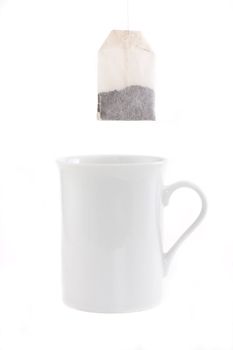 teabag and a white cup isolated on white background