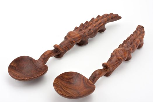 a carved spoon in the shape of a crocodile