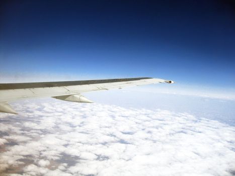 mountains and airplane wing viewing from a plane