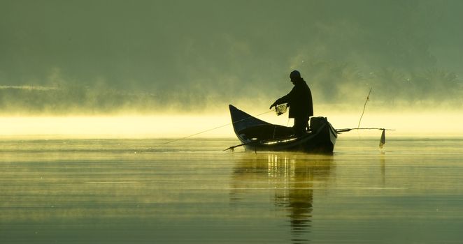 Fishing in the late evening on a boat.