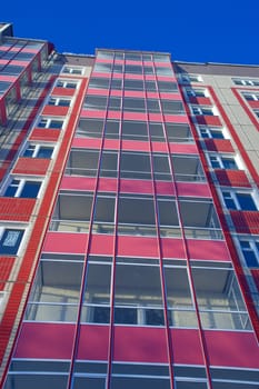 Modern urban building. Glass balconies.