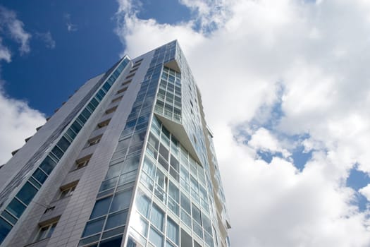 Modern urban building. Glass balconies.
