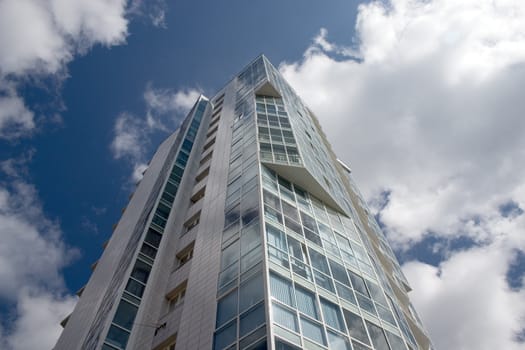 Modern urban building. Glass balconies.