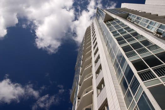 Modern urban building. Glass balconies.