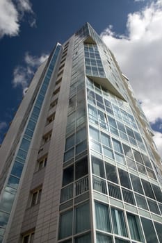 Modern urban building. Glass balconies.