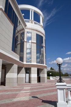 Balcony with columns on a background of the sky with clouds.