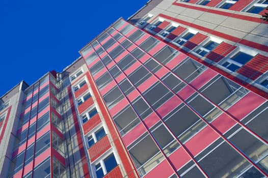 Modern urban building. Glass balconies.