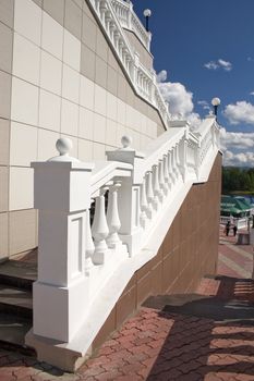 Ladder with a lantern and white balustrade.
