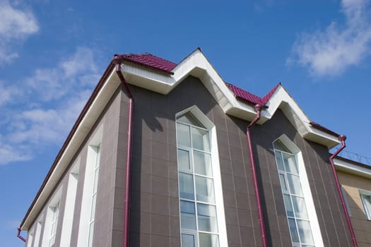 Modern building from a brick. Glass windows.