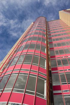 Modern building from a brick. Glass balconies.