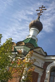  On a background of the light-blue sky church with domes.
