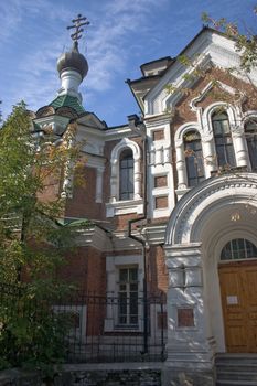 On a background of the light-blue sky church with domes.