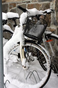 snow-covered bikes