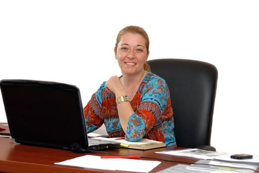 young blond woman in casual cloth at the office desk over white