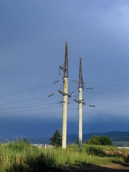 Telephone poles and wires on a background of blue sky