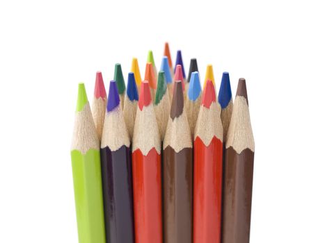Several colored pencils stand together forming a triangle shape.