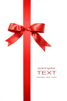 Red vertical gift bow isolated on white background