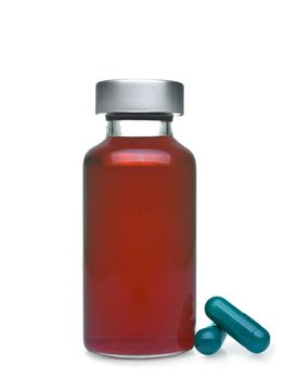 Isolated vial full of red liquid, green pills aside.