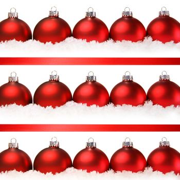 Red christmas balls with snow isolated on white background