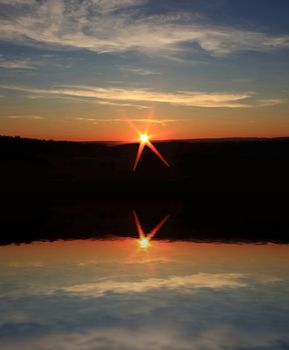 This image shows a sunset over the ocean