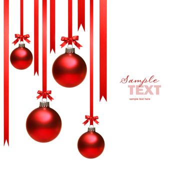 Christmas balls hanging with ribbons on white background