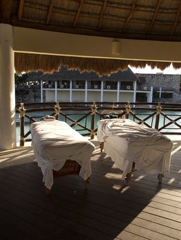 two massage therapy table by the ocean 