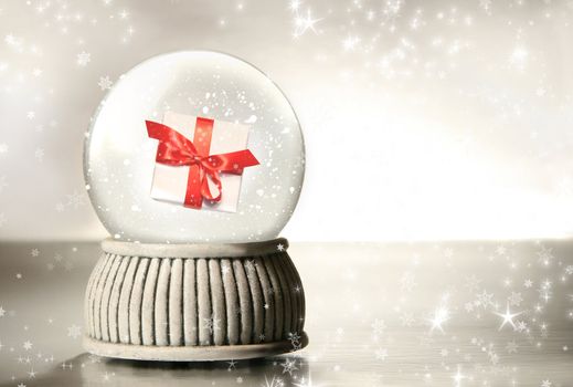 Snow globe against a silver background