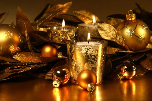 Candles light with a sparkling gold theme