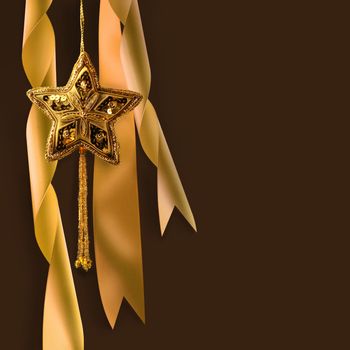 Gold christmas star with ribbons against dark background