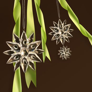 Crystal snowflakes with green ribbons on dark background
