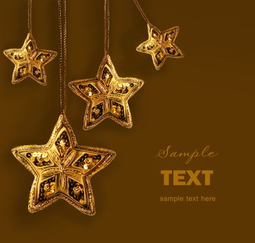 Gold beaded stars isolated on white abckground