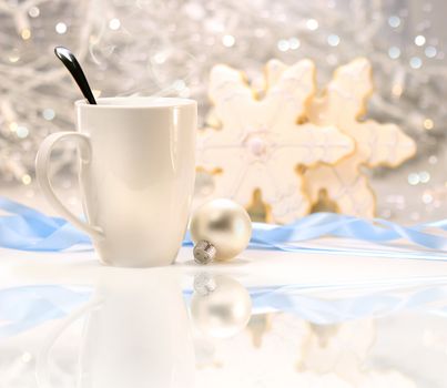 Hot winter drink with sugar cookies on sparkly background