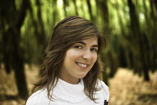 Beautiful happy woman in the autumn park