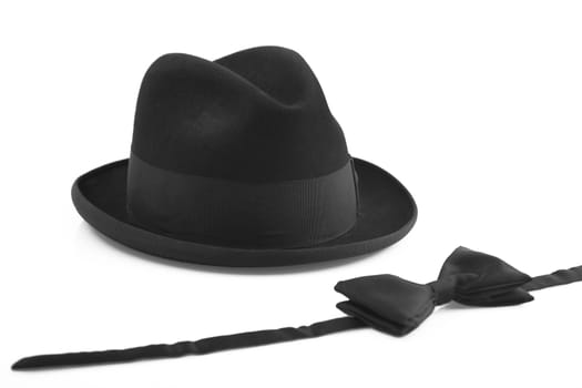 black vintage hat and bowtie on white background