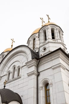 Orthodox cathedral with golden crosses and bathing. Close-up, isolation.