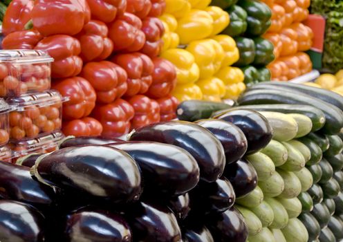 Multicolored particulars vegetables on the grocery market. Multicolored and freshness. Close-up, blurred focus